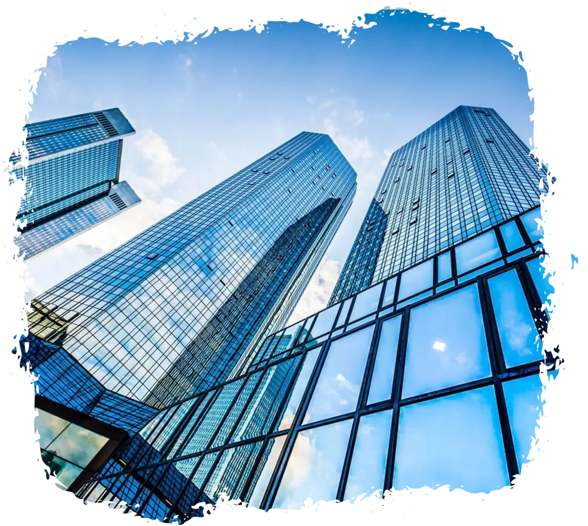 Modern glass skyscrapers reflecting the blue sky.